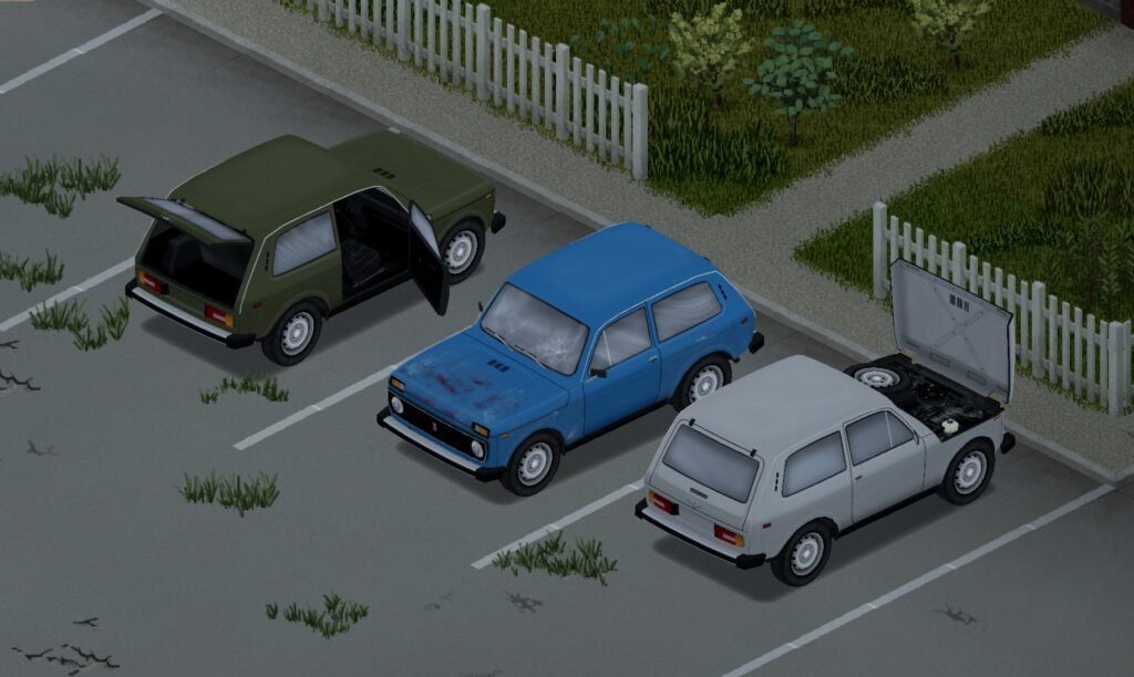 Three Ladas, one green with its boot and front door open, one blue, and one white with its bonnet open